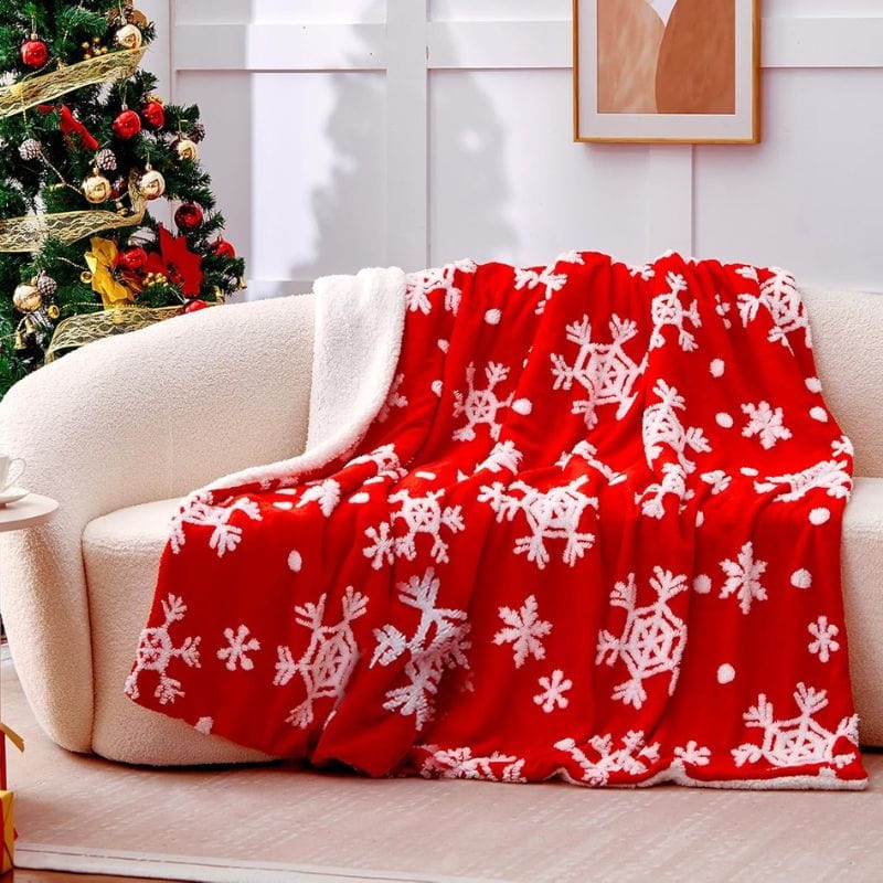 red snowflake throw blanket on couch
