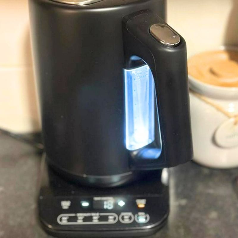 electric kettle on counter with led light