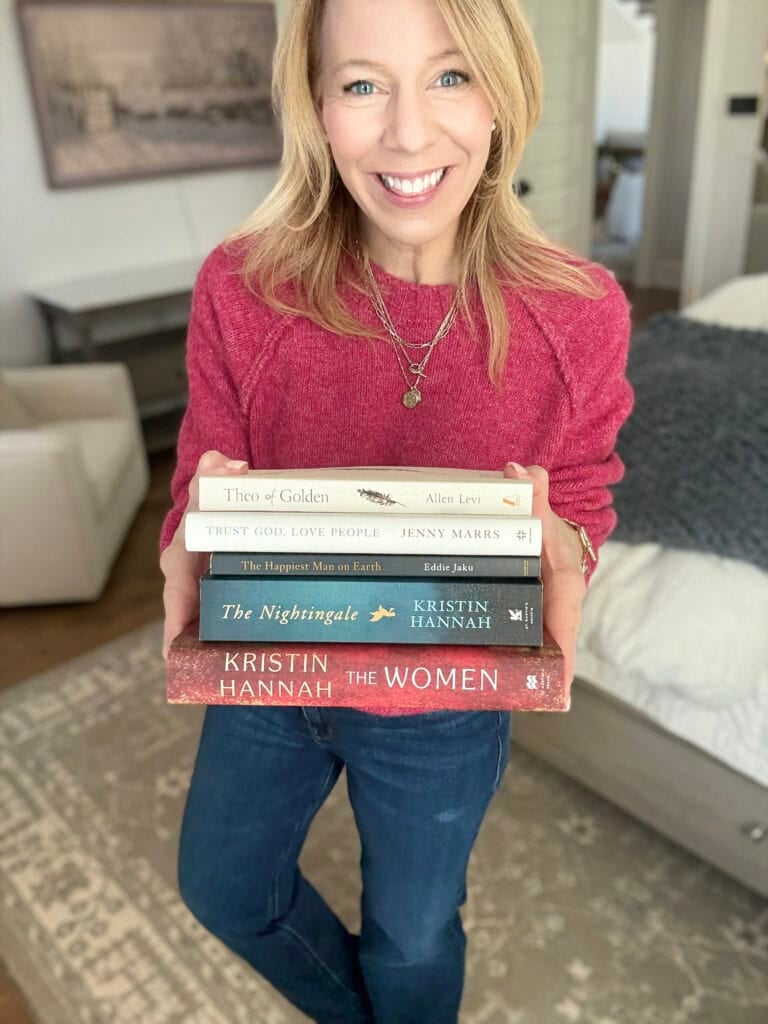 amazon-team-books woman holding books in hand