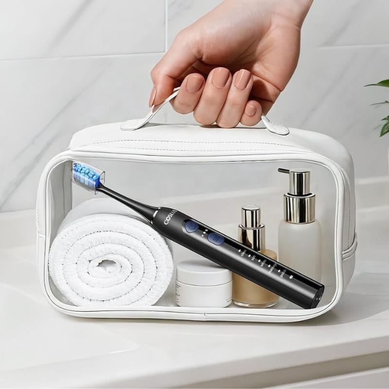 person holding clear bag showing toothbrush