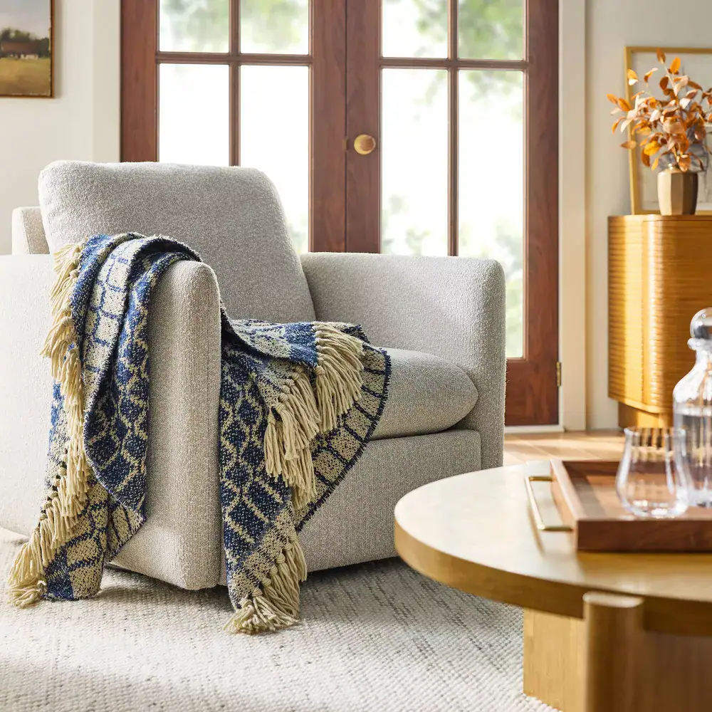 blue and gold throw blanket over chair