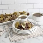slow cooker italian beef finished on platter and white plate