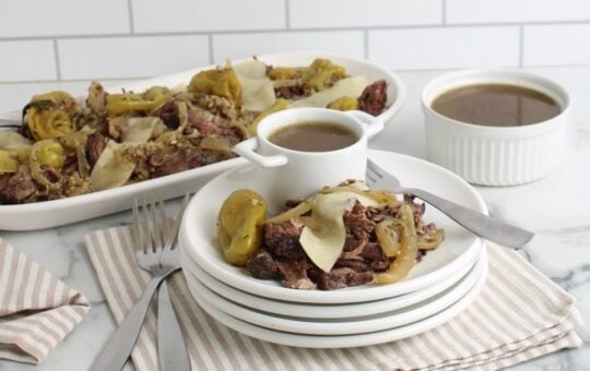 slow cooker italian beef finished on platter and white plate