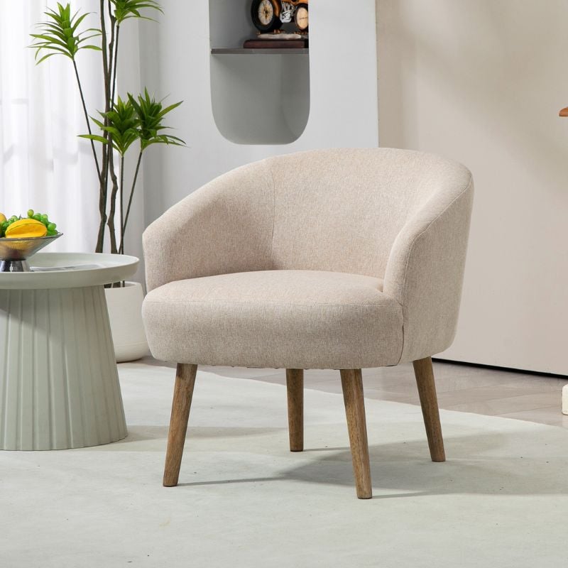 cream colored chair with wooden legs in living room 