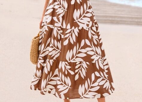 Maxi skirt featuring a brown and white leaf print, perfect for summer beach days. Affordable fashion.
