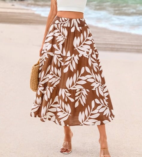 Maxi skirt featuring a brown and white leaf print, perfect for summer beach days. Affordable fashion.