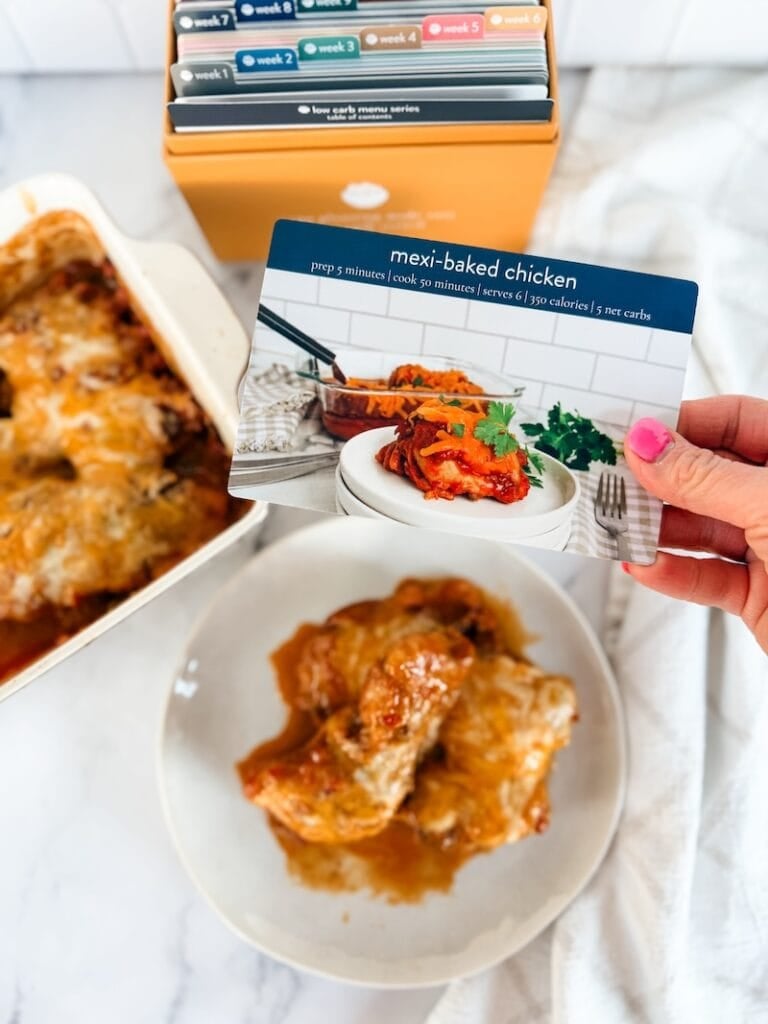 mexi baked chicken on plate with recipe card and box in background