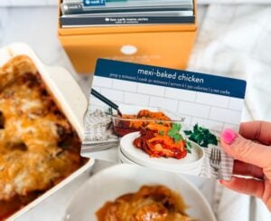 mexi baked chicken on plate with recipe card and box in background