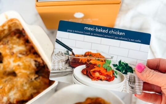 mexi baked chicken on plate with recipe card and box in background