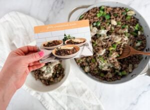 philly cheesesteak bowl recipe card in front of meal prepped