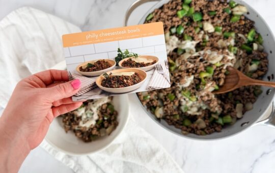 philly cheesesteak bowl recipe card in front of meal prepped