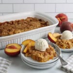 Cake Mix Peach Cobbler Baked and plated with vanilla ice cream