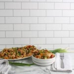 Kung Pao Chicken Noodle Bake on platter and plate with forks