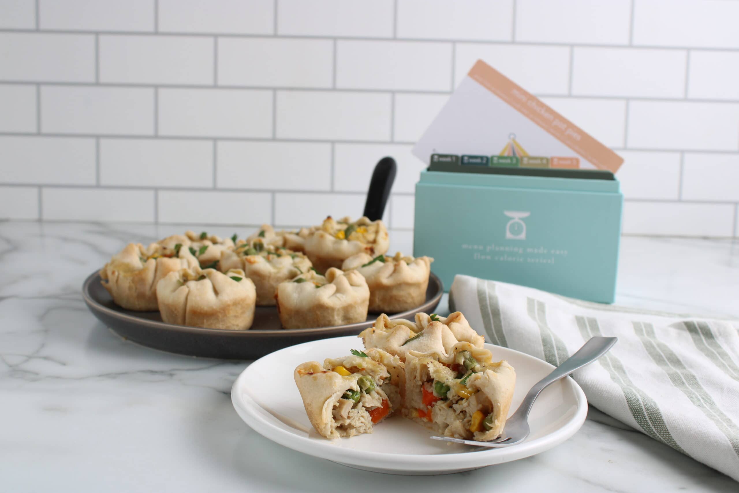 Mini Chicken Pot Pies on a plate with a fork