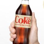 caffeine free diet coke bottle in hand