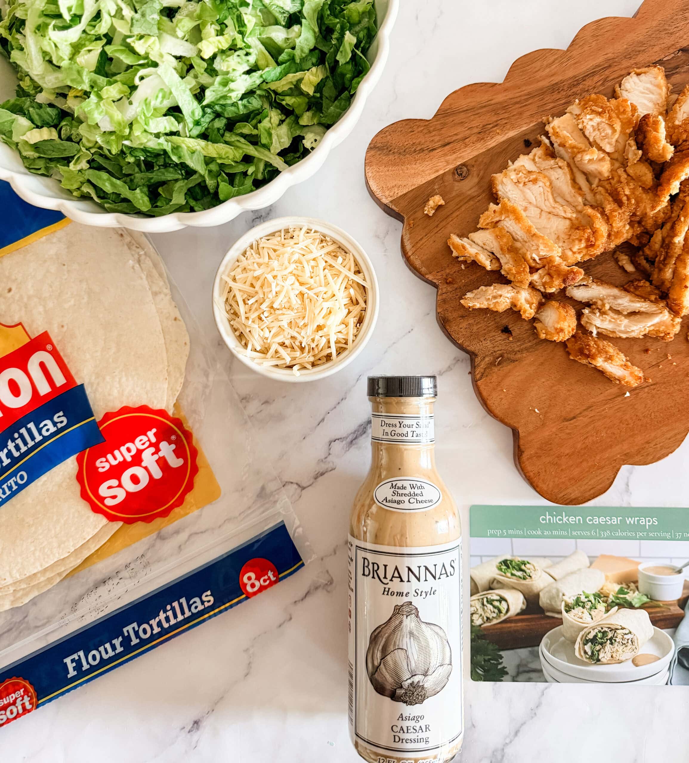 chicken caesar wrap ingredients on counter