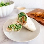 chicken caesar wraps on white plate