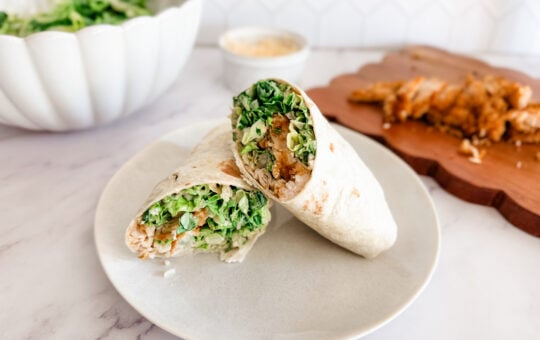 chicken caesar wraps on white plate